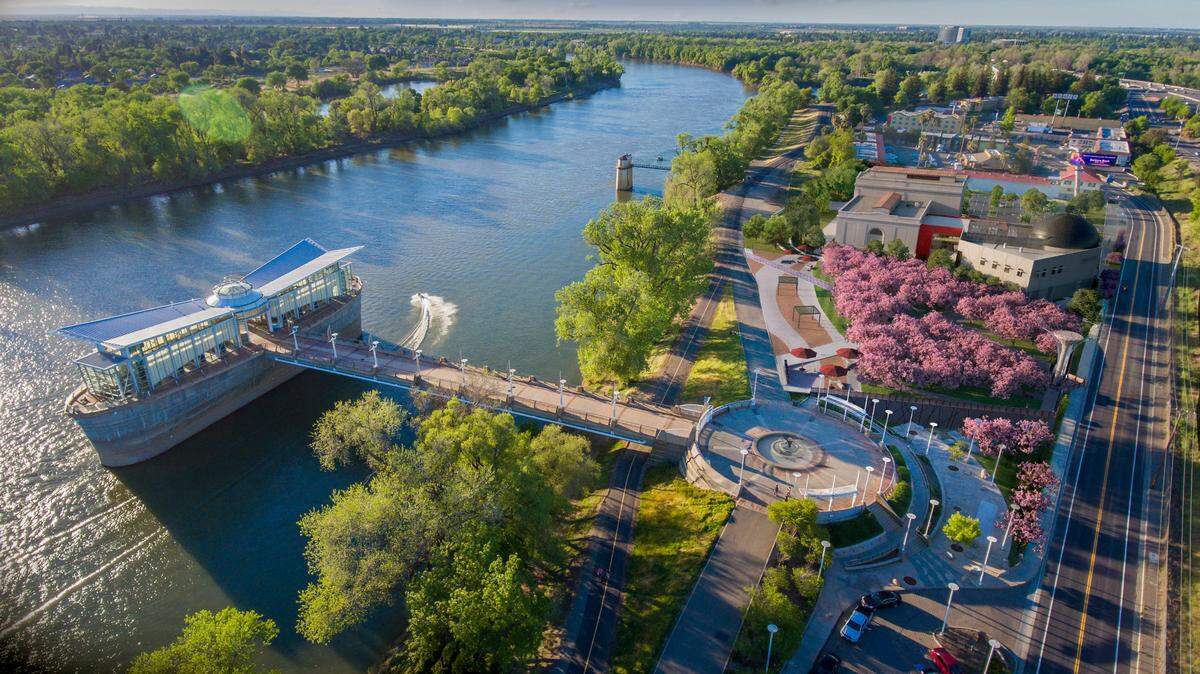 An aerial rendering of the Hanami Line, a cherry blossom park, slated to open at Robert T. Matsui Waterfront Park in 2023.