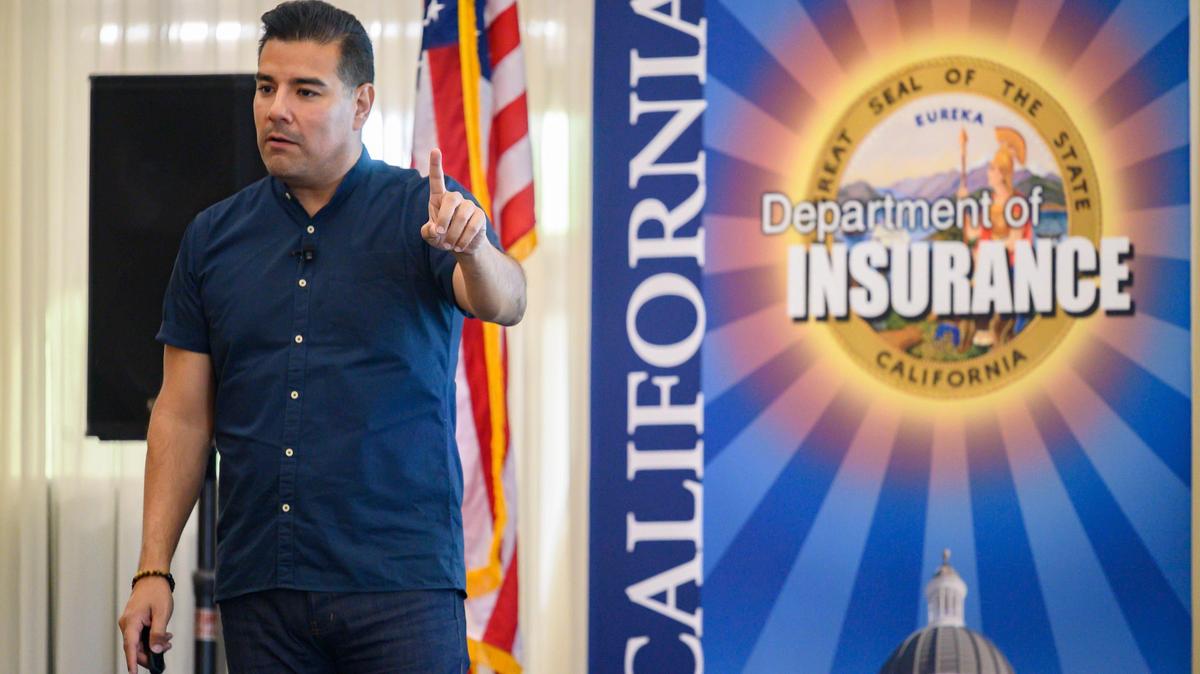 California Insurance Commissioner Ricardo Lara speaks to an overflow crowd at a town hall meeting in Grass Valley, Thursday, August 22, 2019, to address the concerns of local residents after a rise in homeowners insurance premiums and non-renewal letters due to recent California wildfires.