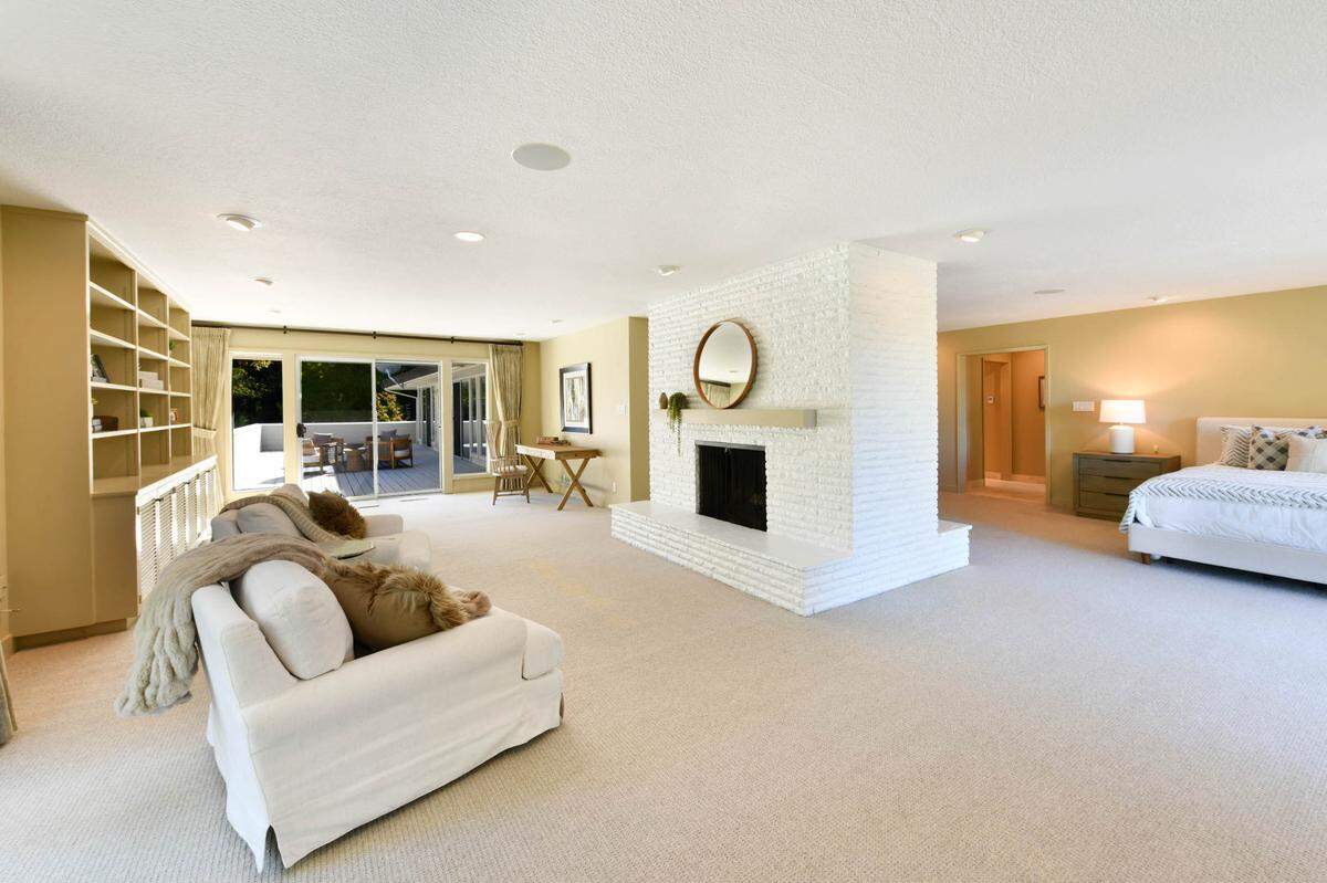 A double-sided fireplace is featured in the primary suite of the Sonoma County property.