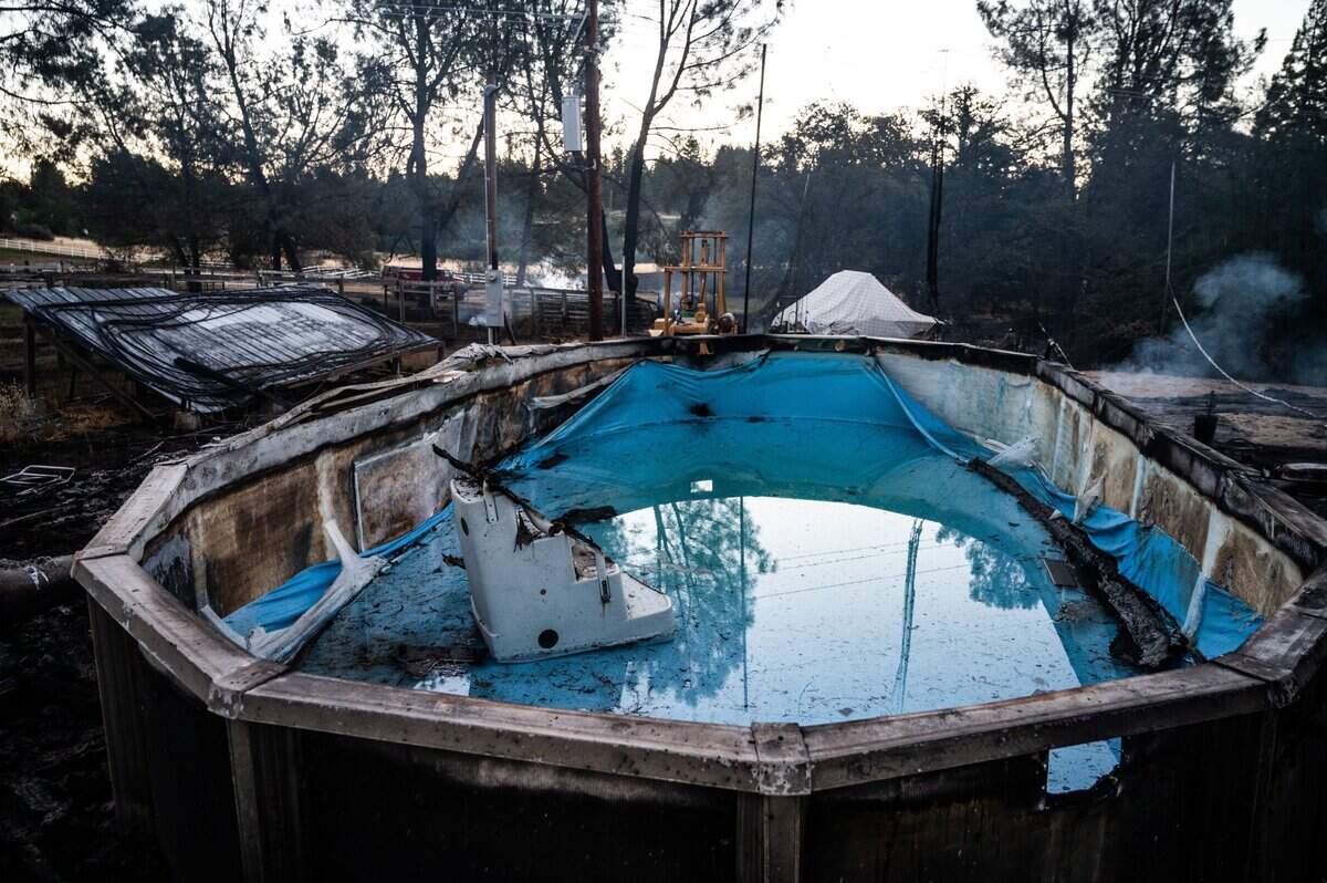 A near empty pool stands after being burned in the River Fire on Mount Olive Road in Chicago Park on Thursday, Aug. 5, 2021.
