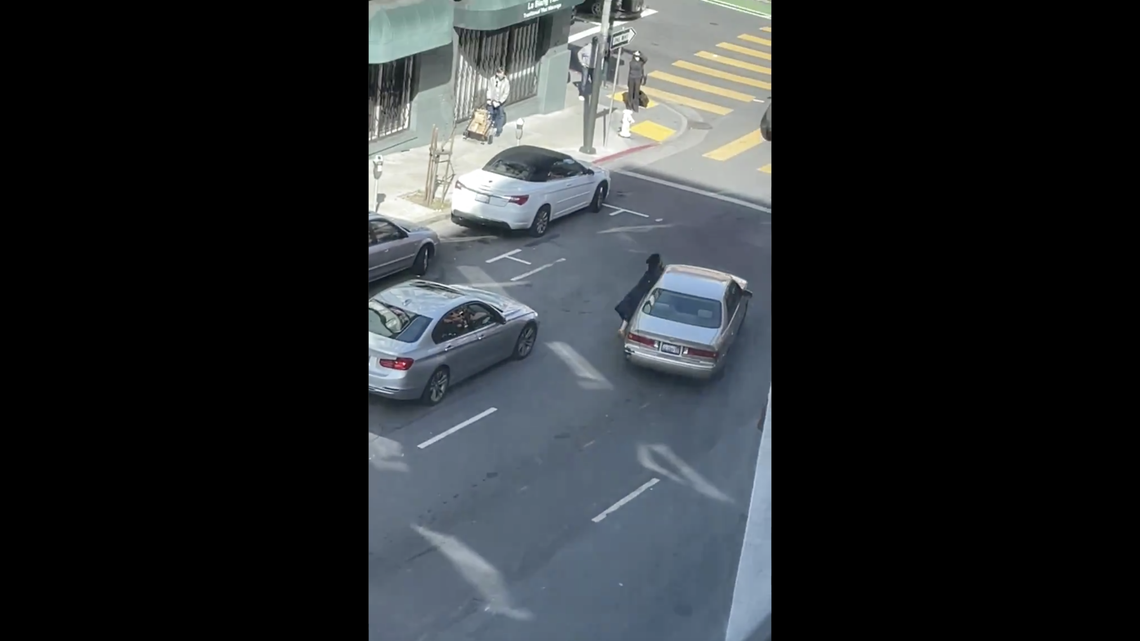 Clarisse was robbed by three people in San Francisco and hung on the side of the car, but was dragged down the street and fell onto the ground, video shows.