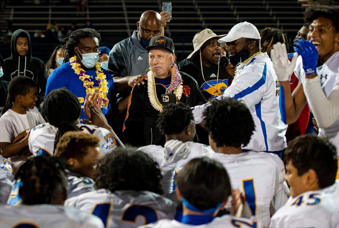 Grant High School head coach Mike Alberghini prepares to speak with his team after they won the final game of a COVID-shifted season in April 2021, as the Pacers defeated Capital Christian in Rancho Cordova. Alberghini died in February.