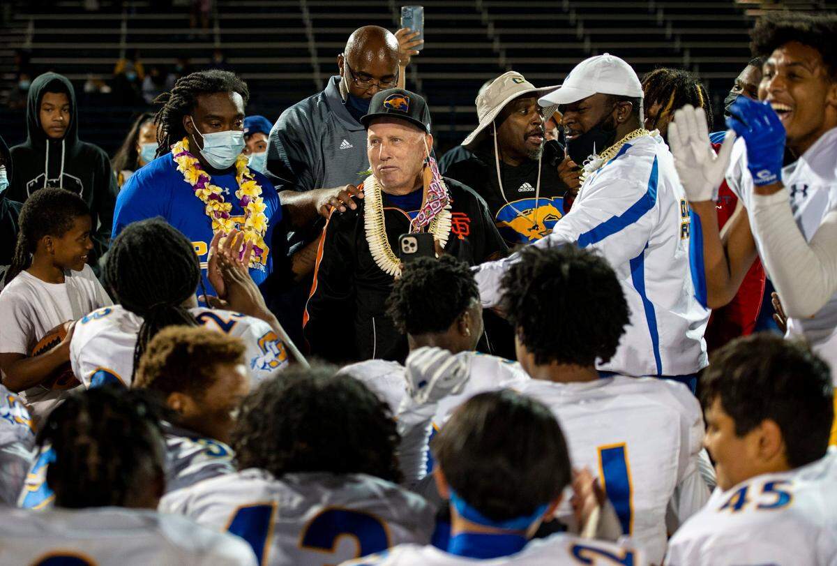Grant High School head coach Mike Alberghini prepares to speak with his team after winning their final game of the season, Friday, April 16, 2021, as the Pacers went up against Capital Christian at Capital Christian High School in Rancho Cordova.