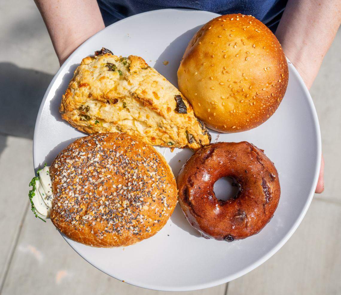 Coconut Dolce De Leche, top left, Egg Sando, top right, Everything But The Bagel, bottom left, and Blueberry Earl Grey, bottom right, are ready to eat at Doughbot on July 28, 2022.