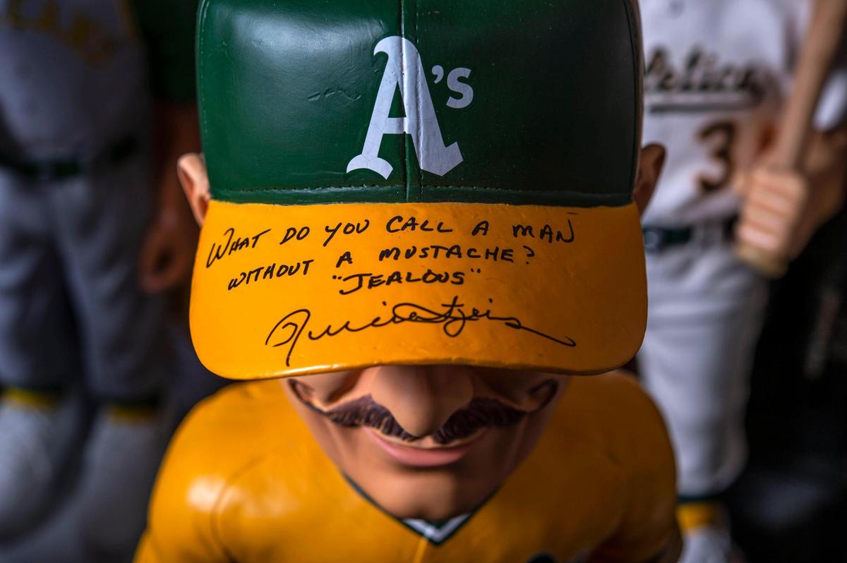 A 3-foot-tall bobblehead of Oakland A’s Hall of Famer Rollie Fingers, recently signed, is displayed in Robb Roberts office. “It creates a connection. I get to talk to Rollie Fingers and that’s pretty cool,” said Roberts.