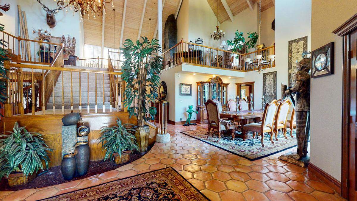 The entry hall gives way to 37-foot ceilings.