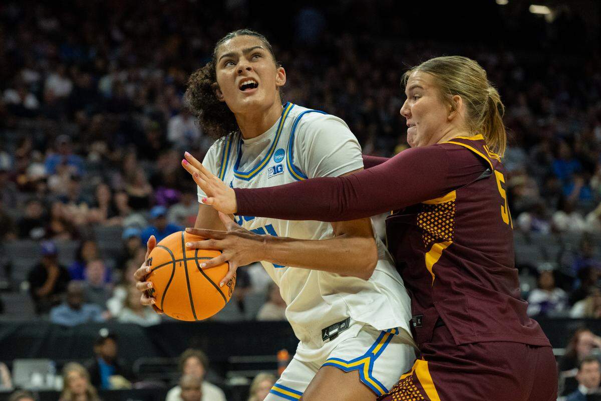 UCLA Bruins center Lauren Betts drives to the basket against Minnesota Golden Gophers center Sophie Hart during the NCAA Women’s Basketball Tournament Sweet 16 game at Golden 1 Center in Sacramento on Friday.