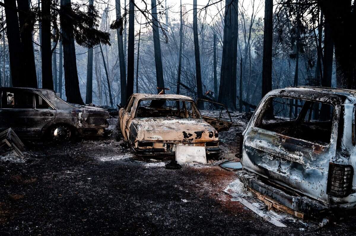 A set of melted cars stand on the rubble of a burned down home during the River Fire on Mount Olive Road in Chicago Park on Thursday, Aug. 5, 2021.