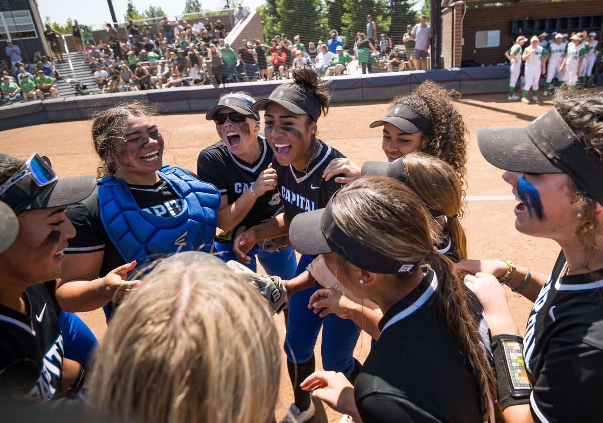 Capital Christian Cougars player Kelsey Joiner (6), center, is flanked by catcher Nani Lose-Mahina (21), left, and pitcher Ayla Tuua after their 4-3 win over the Dixon Rams at the CIF Sac-Joaquin Section Division IV high school softball championship game Saturday at Cosumnes River College.