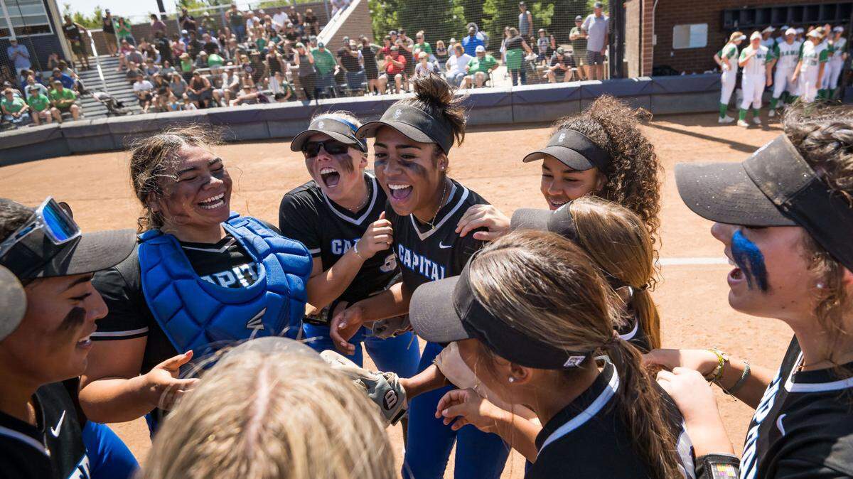 The Capital Christian Cougars’ Kelsey Joiner (6), center, celebrates with catcher Nani Lose-Mahina (21), left, and pitcher Ayla Tuua after their 4-3 win over the Dixon Rams at the CIF Sac-Joaquin Section Division IV high school softball championship game May 27, 2023, at Cosumnes River College. Capital Christian, now called Destiny Christian Academy, starts the 2026 season ranked No. 1 in the region by The Sacramento Bee.