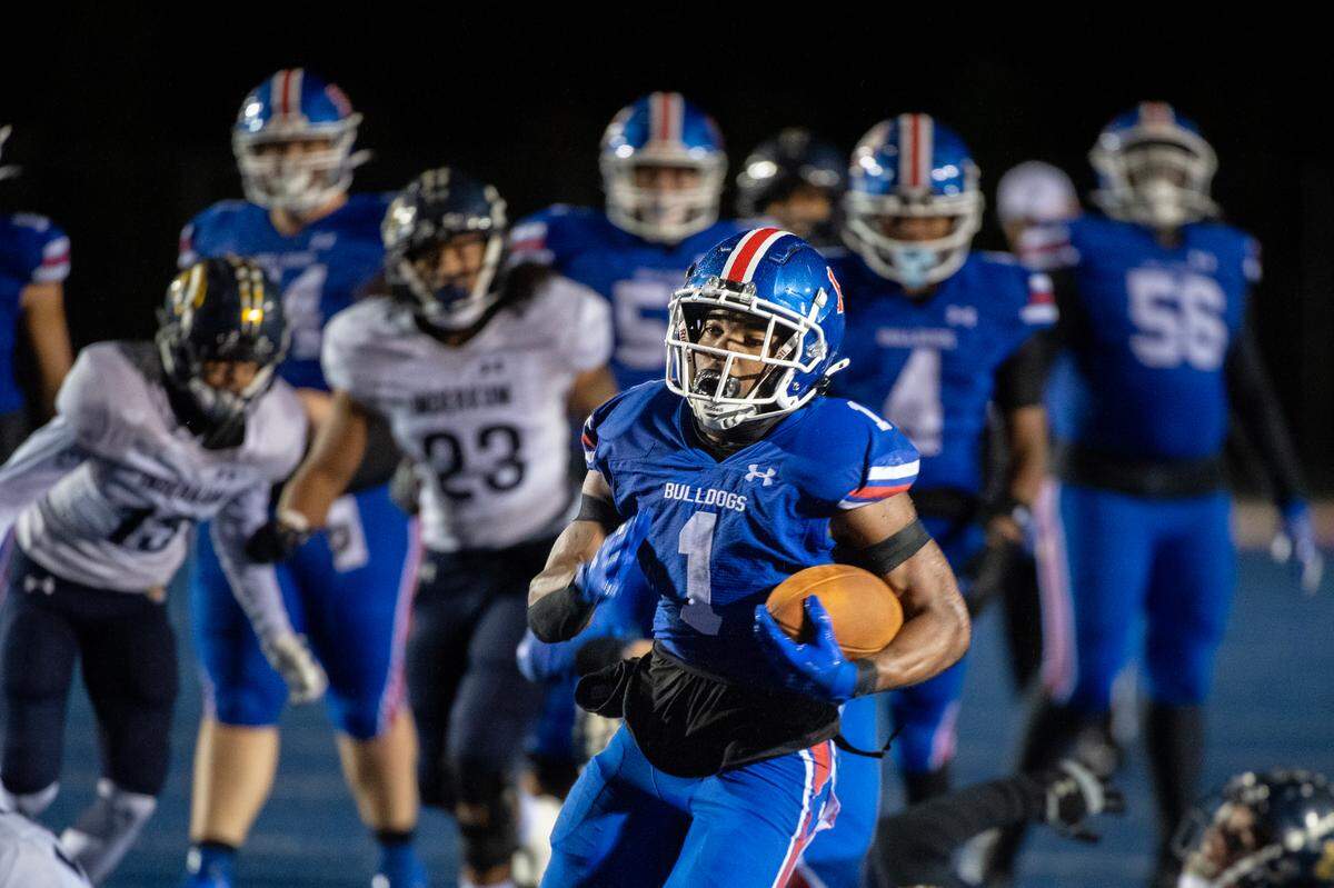 The Folsom Bulldogs’ Jameson Powell (2) runs for a touchdown in the second half of a CIF Sac-Joaquin Section semifinal playoff game against the Inderkum Tigers on Nov. 22, 2024, in Folsom.
