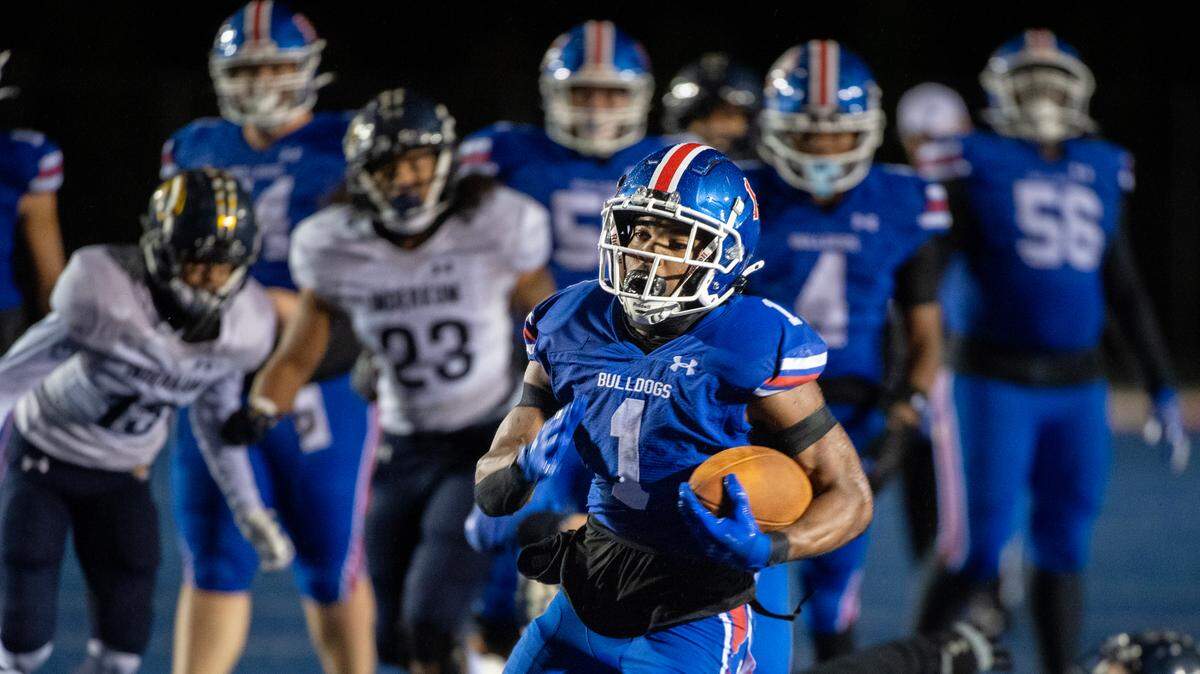 The Folsom Bulldogs’ Jameson Powell (2) runs for a touchdown in the second half of a CIF Sac-Joaquin Section semifinal playoff game against the Inderkum Tigers on Friday. 