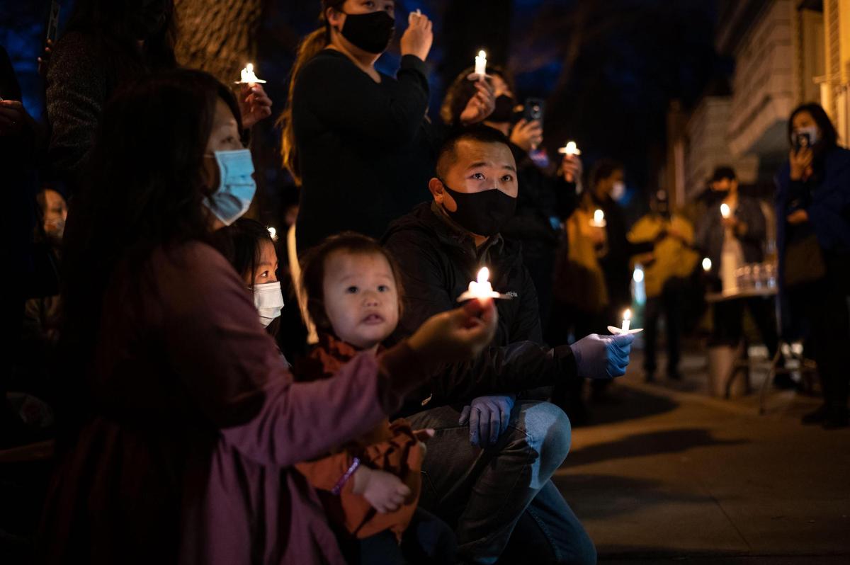Long Yang, center, listens as family members and friends honor his late father, Chue “Calvin” Yang, with story after story about the DJ Market owner Saturday, Jan. 30, 2021, in Sacramento. The longtime shopkeeper, dubbed by some as the “midtown mayor,” died unexpectedly while at work Tuesday. “We do appreciate you guys — your stories, your affection, all your love that you shared with us today,” Long said. “To me, it truly uplifts my spirit because I know that he was loved, and know that he loved all you guys too. Again, thank you to the midtown community.”