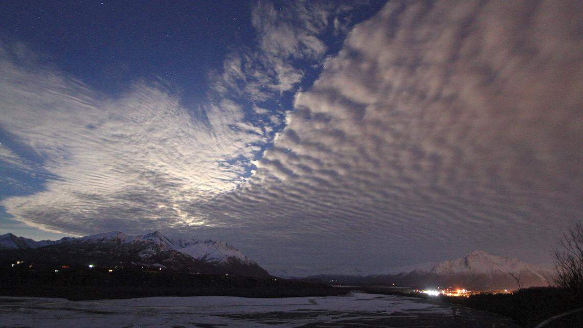 FILE - Clouds over the sky over Lazy Mountain and the Matanuska River on March 23, 2016, in Palmer, Alaska. (AP Photo/Dan Joling, File)