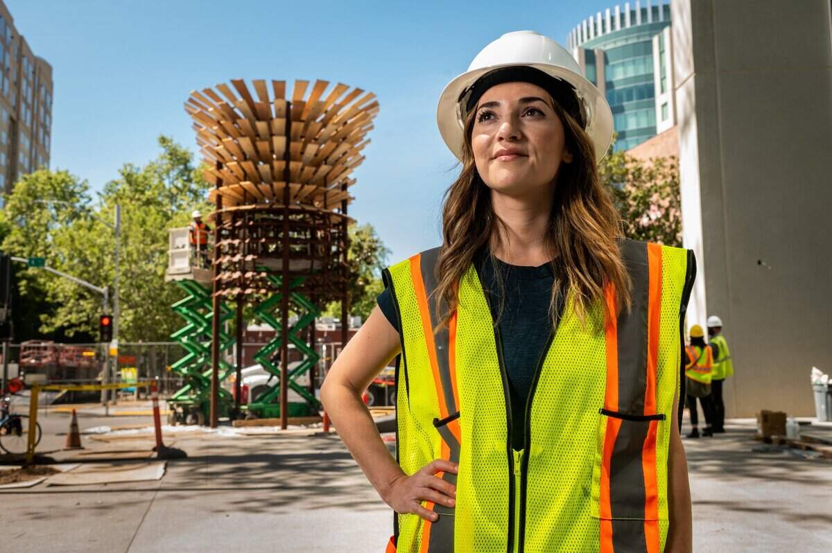 Artist Kimberly Garza stands in front of her new sculpture California Cathedral at the Sacramento Convention Center in downtown Sacramento on Thursday, April 29, 2021. California Cathedral is really a homage to the forest of California that we have lost to climate change in the last decade, she said.