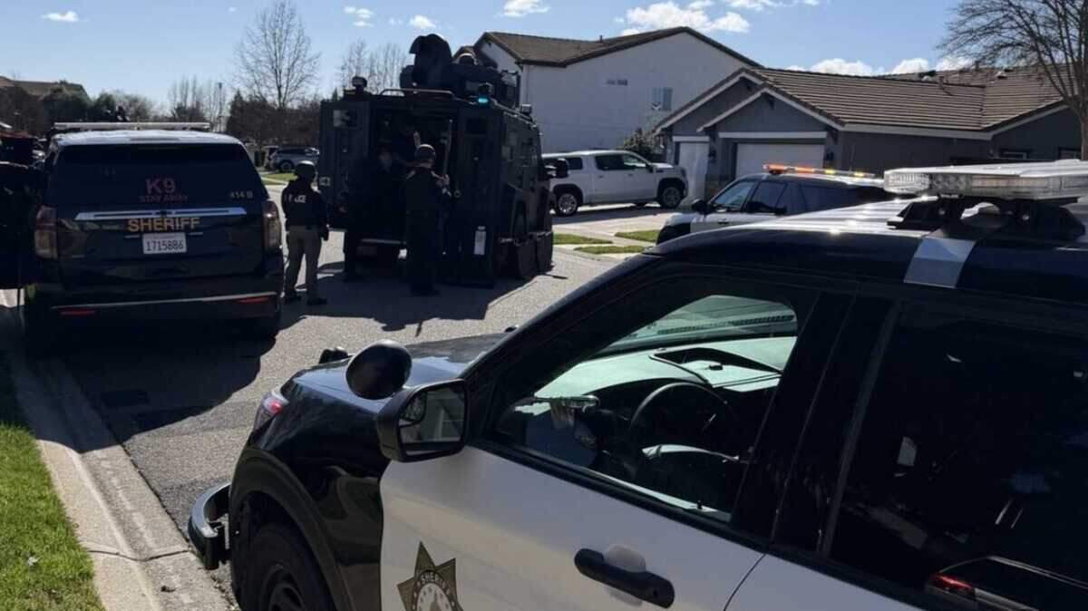 Sacramento County Sheriff’s Office Special Enforcement Detail team members arrive in a BearCat armored vehicle at the scene of a barricaded suspect on McRoberts Drive in Mather on Thursday, Feb. 12, 2026.