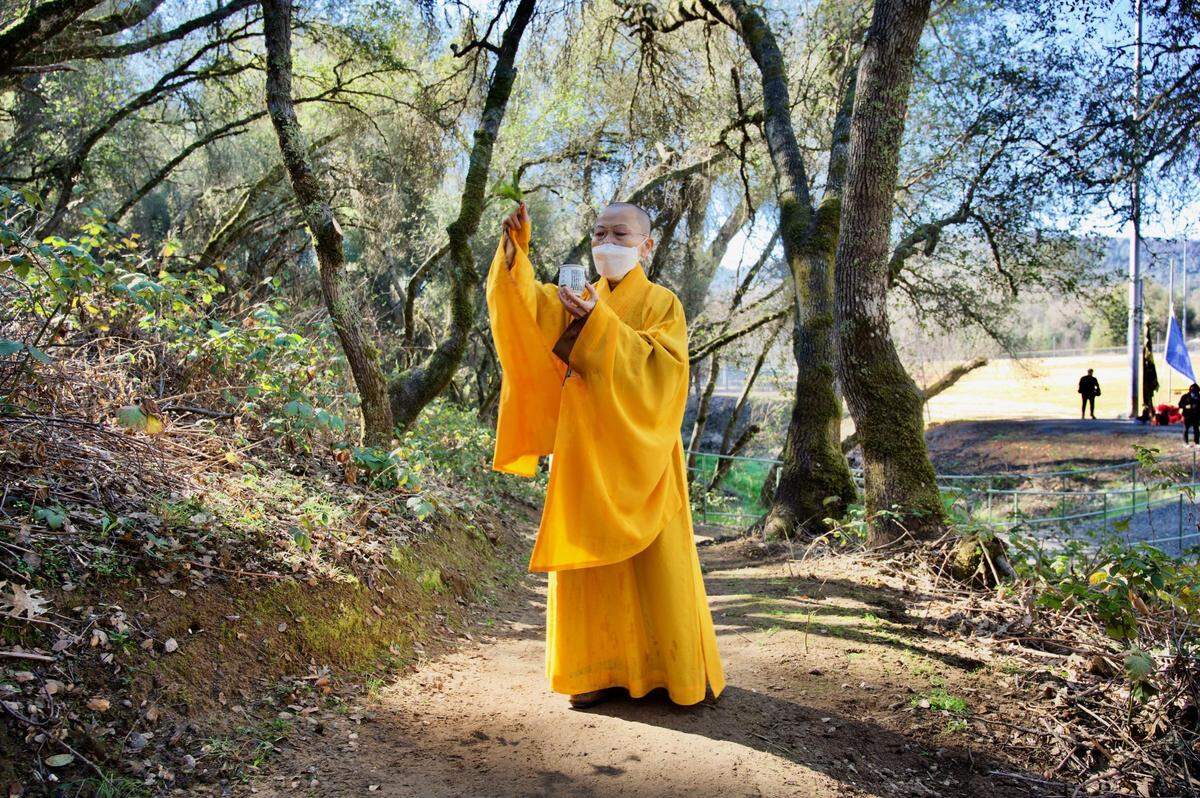 Ru Hsian, of the Fo Guang Shan Bodhi Temple in Elk Grove, blesses the new Gam Saan Trail in El Dorado County on Friday.