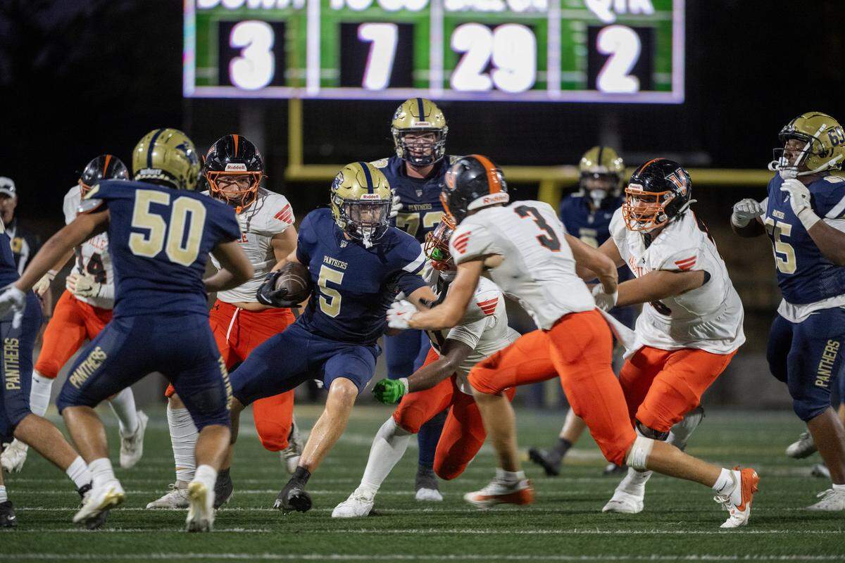 The West Park Panthers ’ Topher Petersen (5) cuts back against the Vacaville Bulldogs defense In the first half Friday, Aug. 29, 2025, in Roseville.