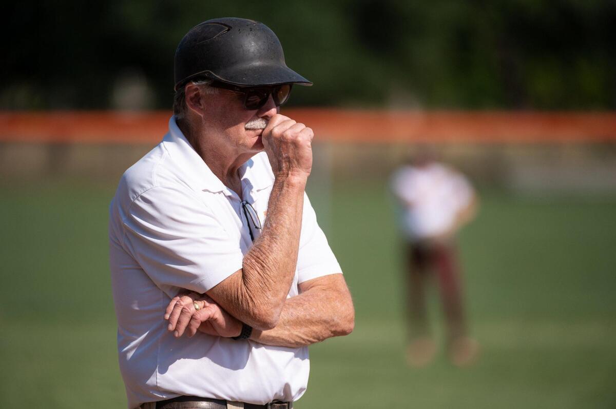 Roseville’s softball coach Art Banks signals to his players during a game against Woodcreek High School Monday at Roseville High School. Banks has won over 750 games in his 38-year coaching career.