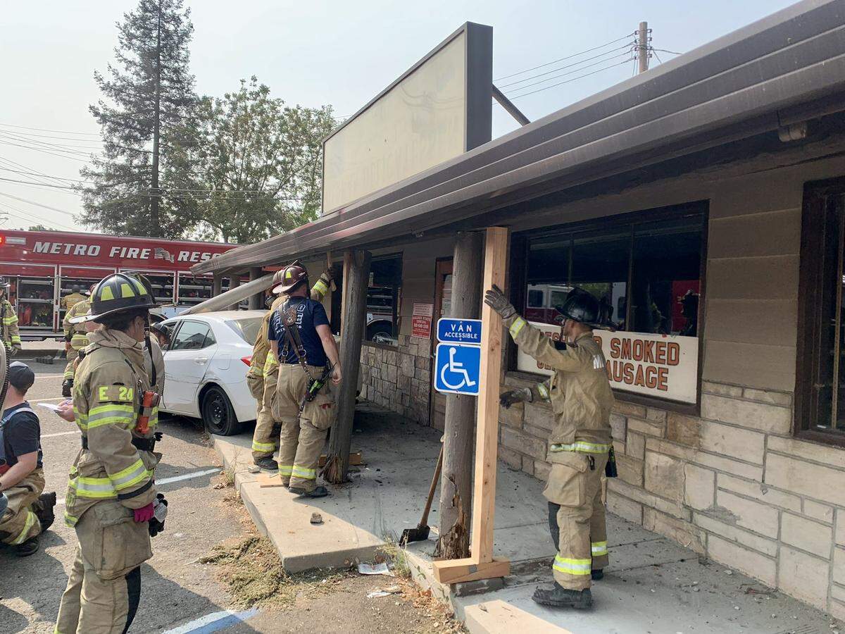 Fire personnel worked to shore up the building after the crash.