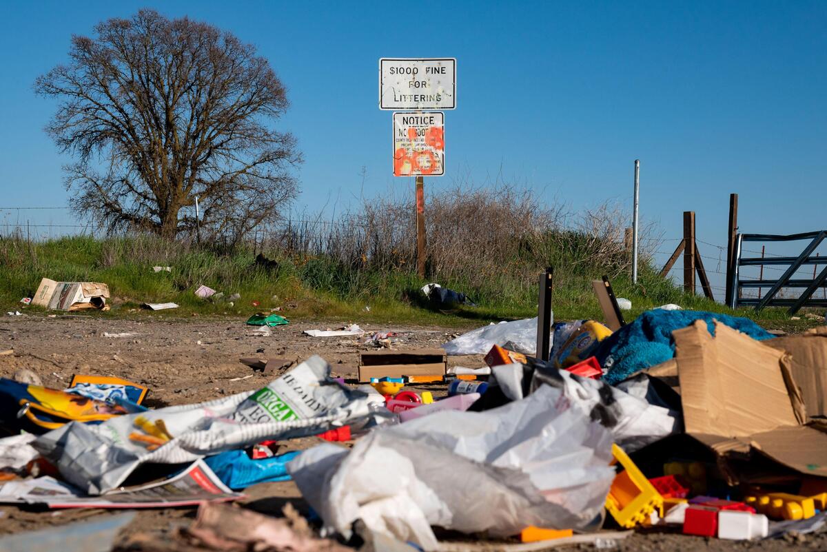 Illegally-dumped waste is seen in piles at the corner where Tan Woods Road turns into Kasser Road Wednesday, Feb. 26, 2020, near the border of Sacramento and Placer counties. The streets west of Watt Avenue are close to Dry Creek — a listed salmon habitat — and have had chronic problems with people illegally dumping waste of all kinds.