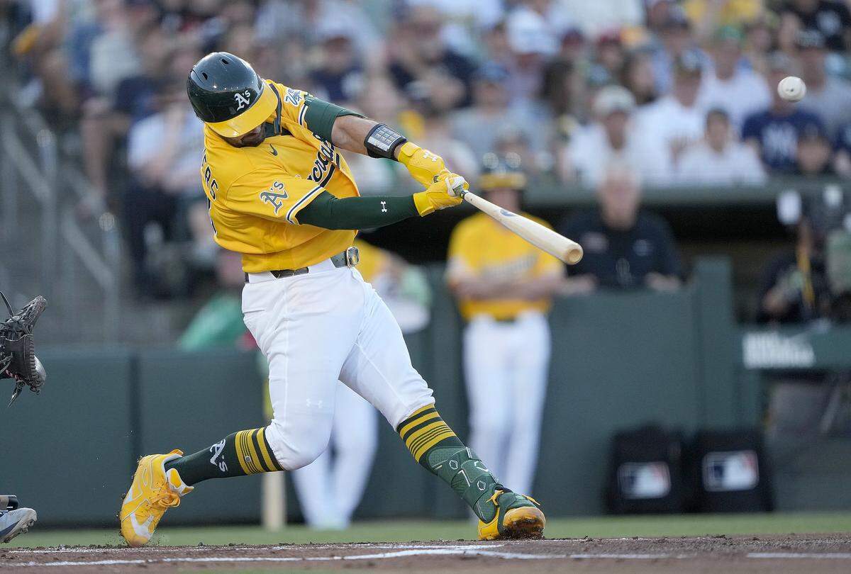 Shea Langeliers of the Athletics hits a two-run home run against the New York Yankees in the bottom of the first inning at Sutter Health Park on Saturday in West Sacramento.