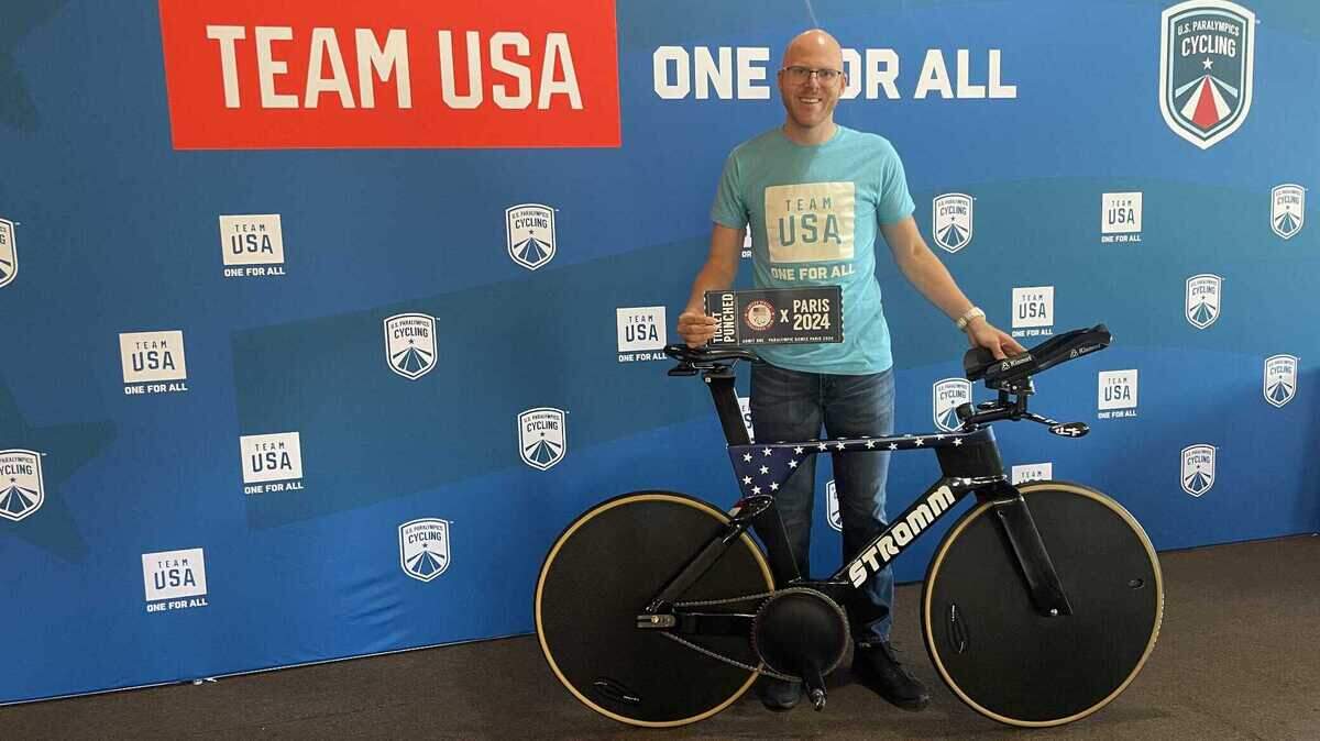 Bryan Larsen poses with his track racing bicycle at the Team USA paralympic presentation on July 8, 2024. Larsen is one of seven athletes on the USA’s paralympic cycling team headed to the Paris Olympics.