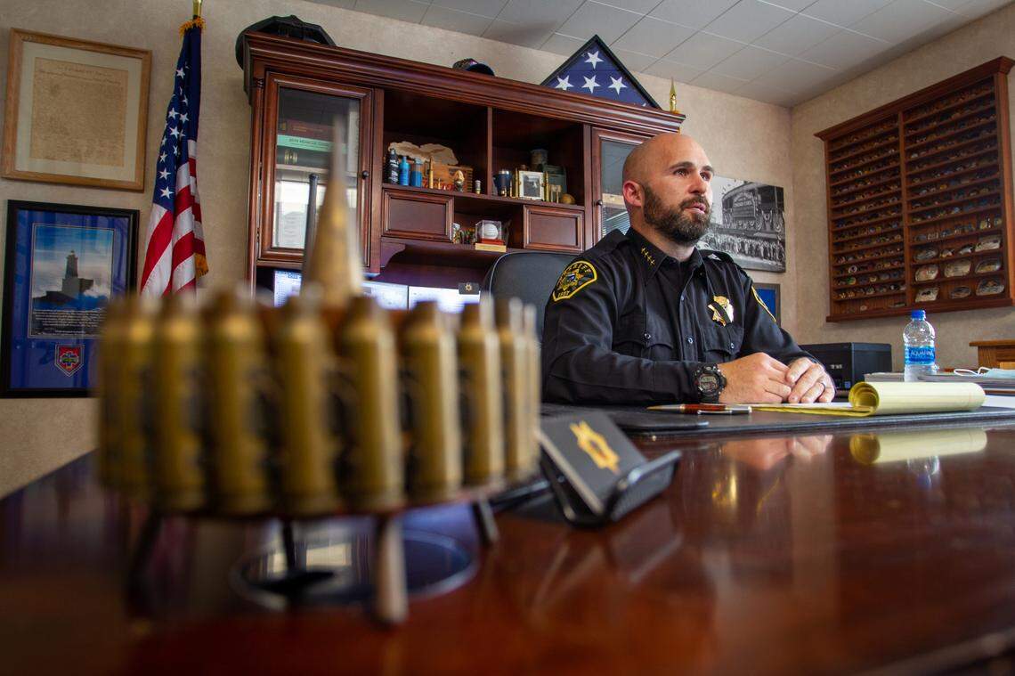Then-Del Norte County Sheriff Erik Apperson speaks with a reporter in August 2021 in his Crescent City office about criticism of his department. Apperson, who resigned unexpectedly, left the office in September.