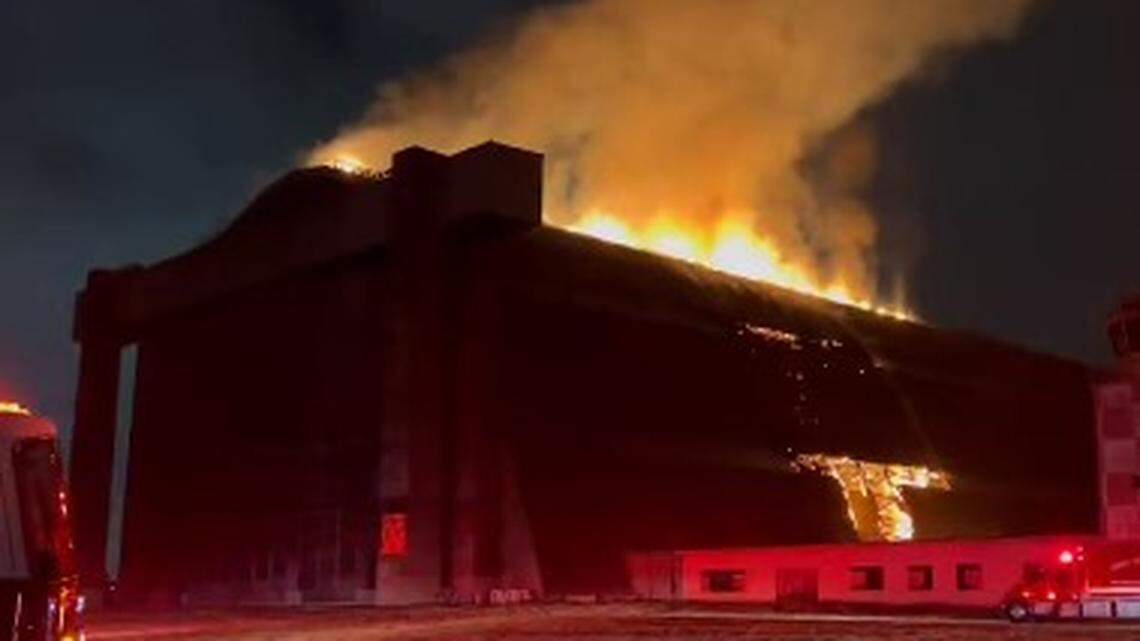 Flames destroyed a historic blimp hangar featured in “The X-Files” and “Pearl Harbor” in Tustin, California firefighters say.