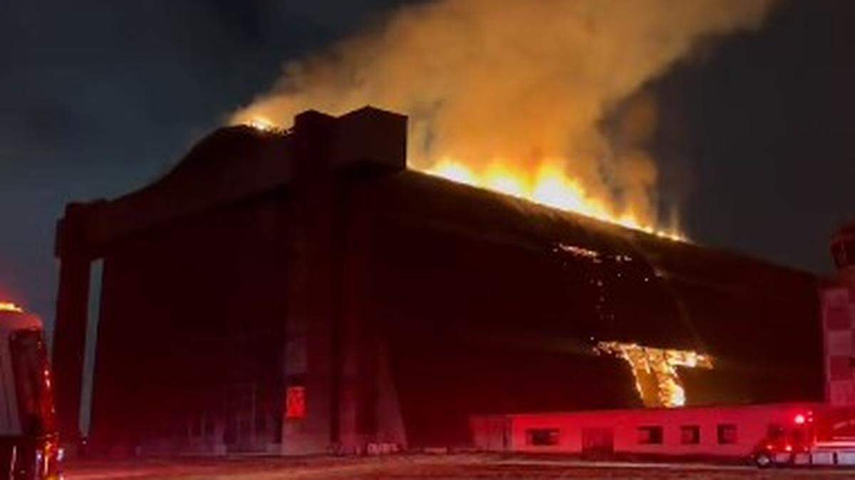 Flames destroyed a historic blimp hangar featured in “The X-Files” and “Pearl Harbor” in Tustin, California firefighters say.