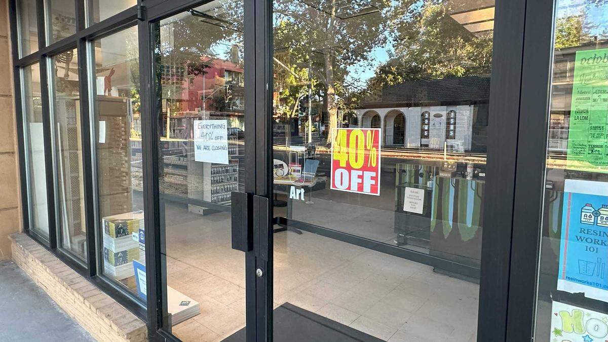 Sale signs adorn the doors of University Art at 26th and J Street on Friday, Oct. 4, 2024. The longtime art store, which took over Taylor’s Art Store in 1998, is closing. The building had been an art and framing store since Van’s Art Shop was started in 1957. The owners of University Arts are also selling the midtown properties.