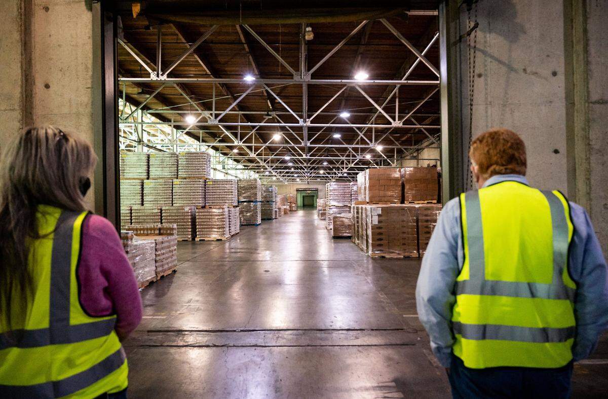 California Emergency Foodlink CEO and founder John Healey, right, walks with Linda Cristian, CFO and president, through Foodlink’s vast warehouses during a tour Nov. 10 on the Depot Park business campus in Sacramento.