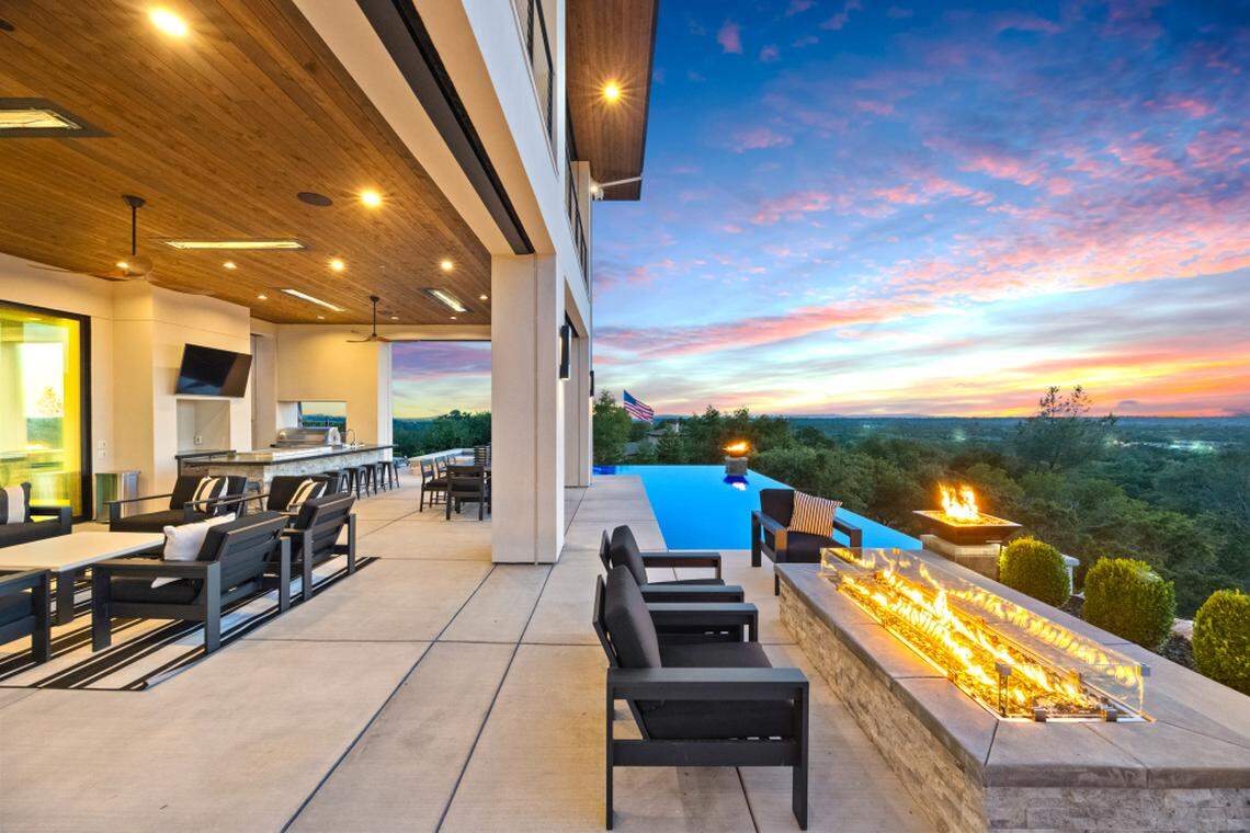 The Pebble Tech infinity edge saltwater pool and spa, Baja shelf, and expansive patios make for a private luxury retreat on 2.4 acres.