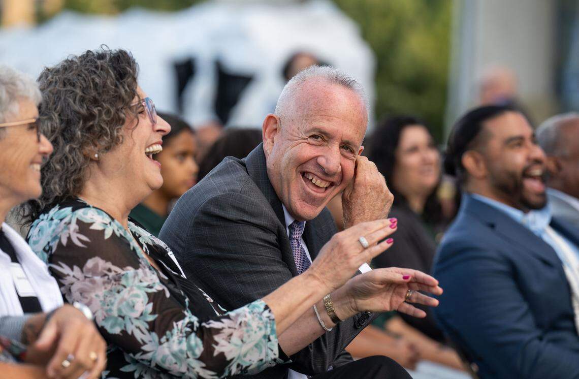 Sacramento Mayor Darrell Steinberg and his wife Julie laugh during remarks by CLTRE founder Roshaun Davis before the mayor gave his final State of the City address in September.