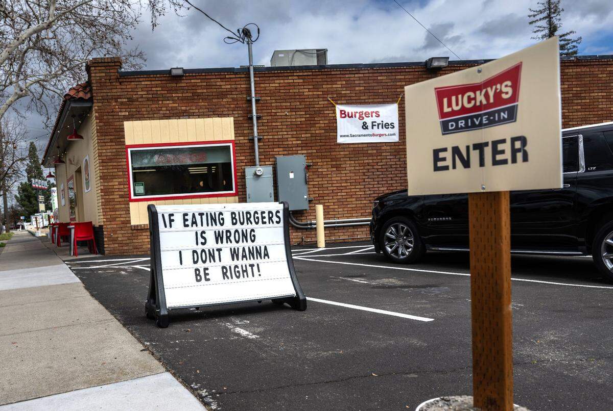 “If eating burgers is wrong, I don’t wanna be right!” says a sign at Lucky’s Drive-In, a new burger restaurant on Franklin Boulevard in Curtis Park, on Thursday, March 6, 2025.