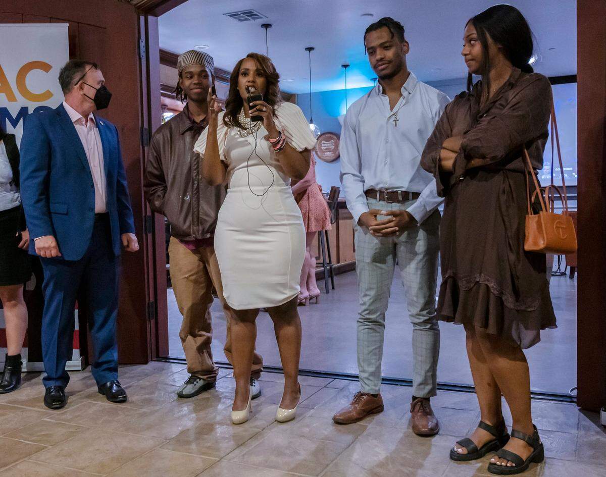 Sacramento District Attorney candidate Alana Mathews, center, joined by husband, Eugene Arcurio, left, and her three children, speaks to the crowd gathered for an election night watch party Tuesday at Wolfe Heights Winery in Sacramento County. Mathews was trailing in early returns.