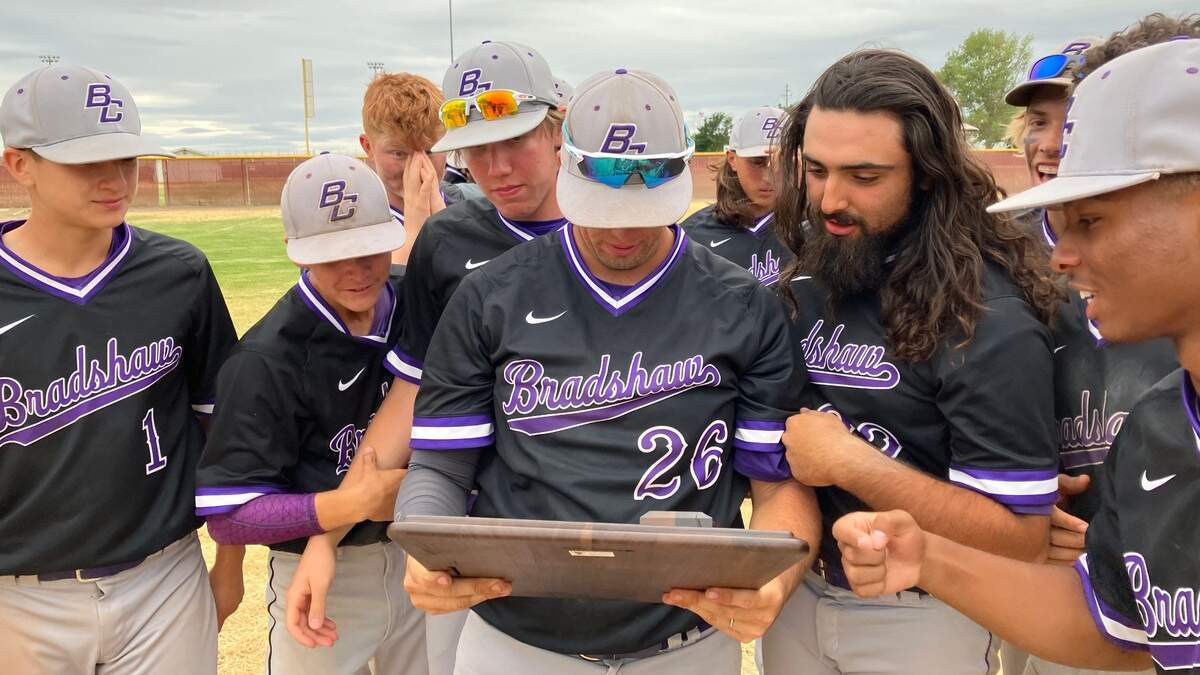 Bradshaw Christian players admire their Northern California region trophy after beating Colusa 9-0 on Saturday, June 4, 2022.