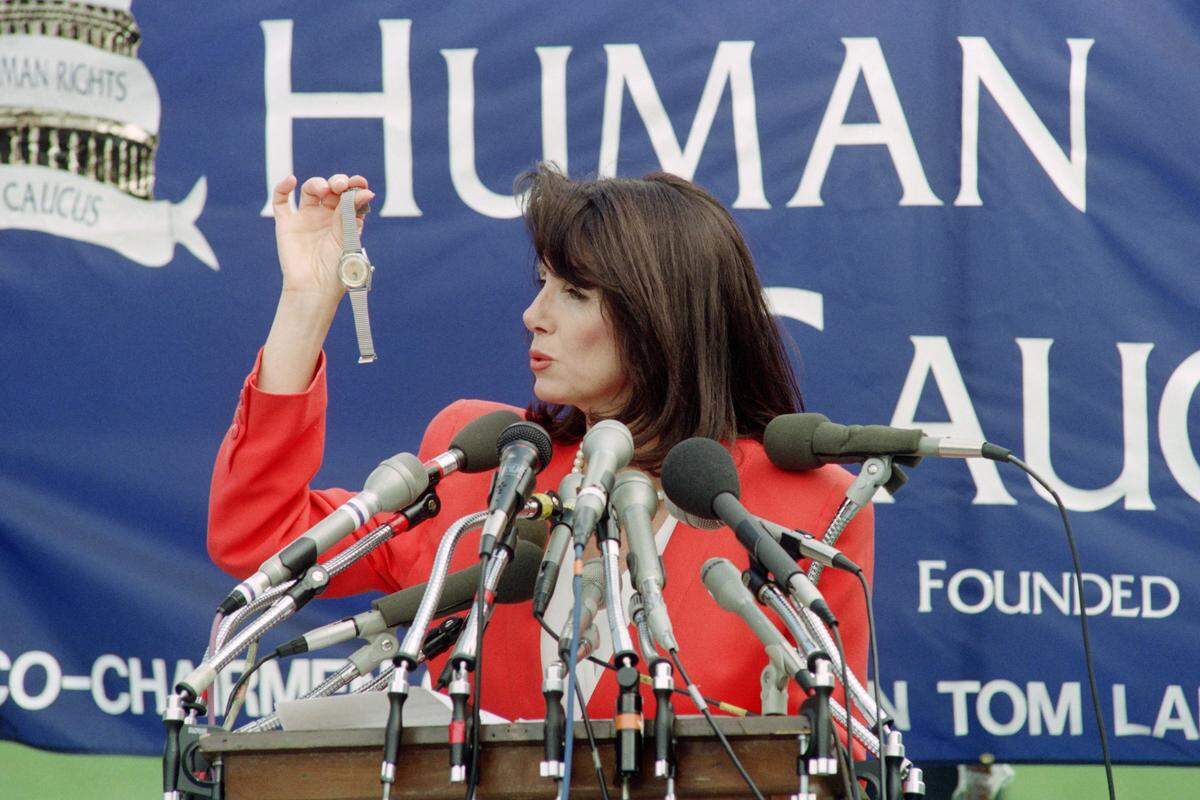 Congresswoman Nancy Pelosi, D- California, holds a watch  on June 4, 1991, that was reportedly smuggled out of China. Pelosi said the watches were given to soldiers who helped crush the Tiananmen Square protesters two years ago. Pelosi spoke at a rally on the west lawn of the U.S. Capitol to commemorate the massacre.