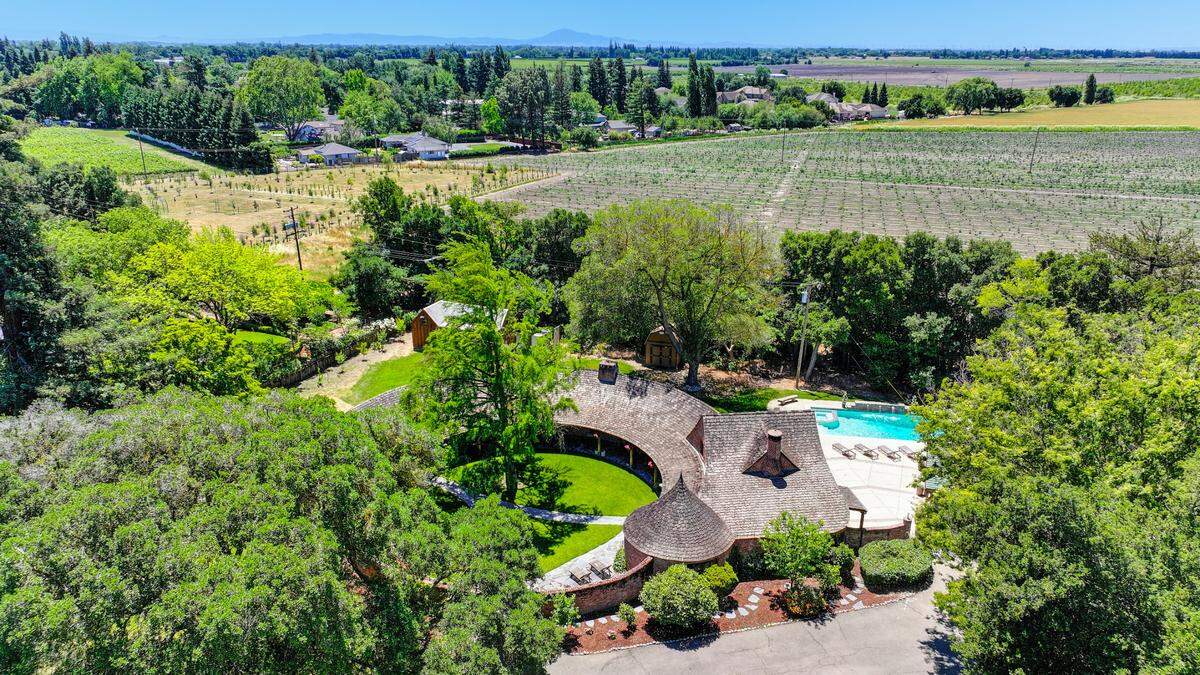 The storybook home for sale on a two-acre property along the Sacramento River was built by architect Carr Jones in 1936.