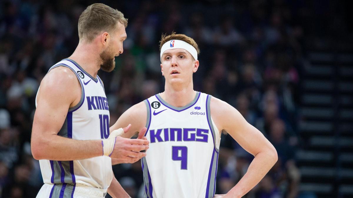 Sacramento Kings forward Domantas Sabonis (10) talks with guard Kevin Huerter (9) during a free throw shot in the first half of the NBA basketball game Sunday, April 2, 2023, at Golden 1 Center. The Spurs won 142-134 in overtime.