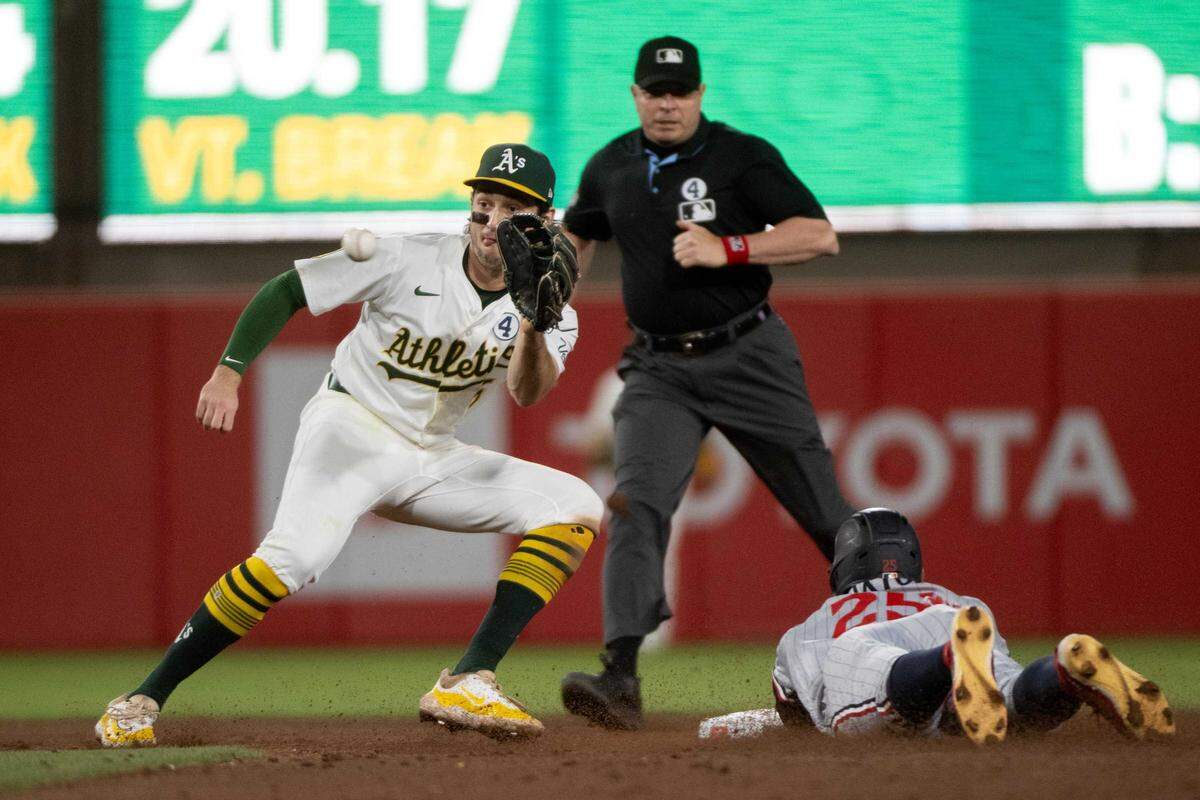 Minnesota Twins outfielder Byron Buxton (25) steals second base as Athletics shortstop Jacob Wilson (5) waits for the ball in a June 2 game at Sutter Health Park in West Sacramento. Wilson signed a seven-year, $70 million contract extension with the Athletics, the team announced Friday.