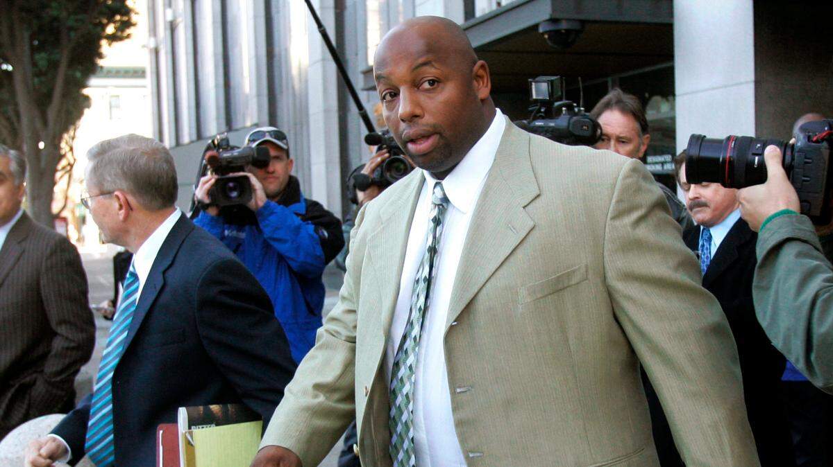 Former NFL player Dana Stubblefield leaves a federal courthouse in San Francisco in 2008. Stubblefield was sentenced to 15 years to life in prison Thursday for raping a prospective babysitter at his Morgan Hill home.