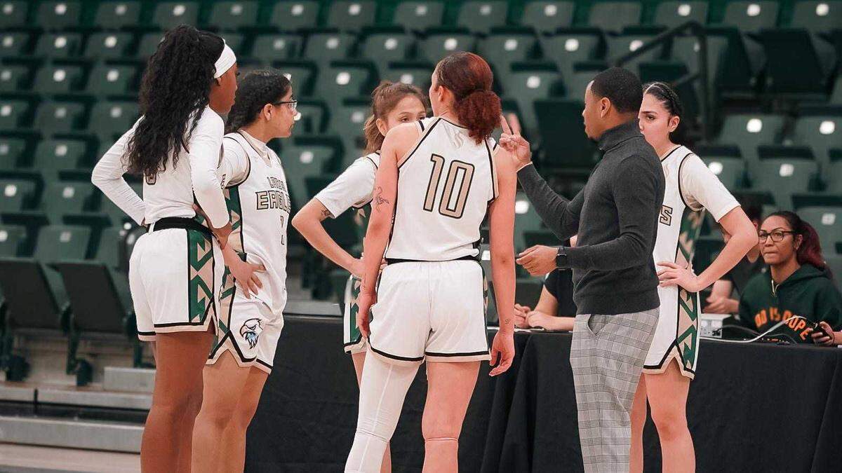 Christian Chapman coaching players with the Lady Eagles during a home game at Sacramento State. Chapman is the primary coach of the team.