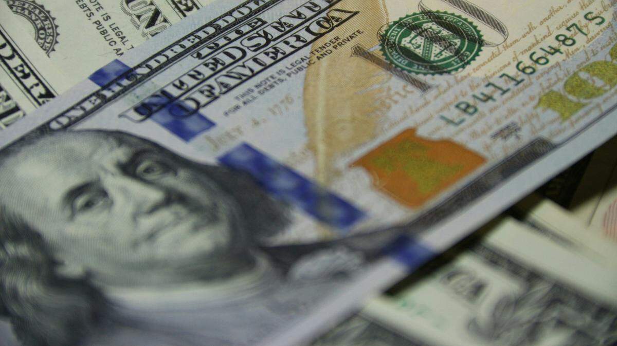 A former U.S. Postal Service employee and his son will serve prison time in connection with the theft of more than $5 million, feds say.