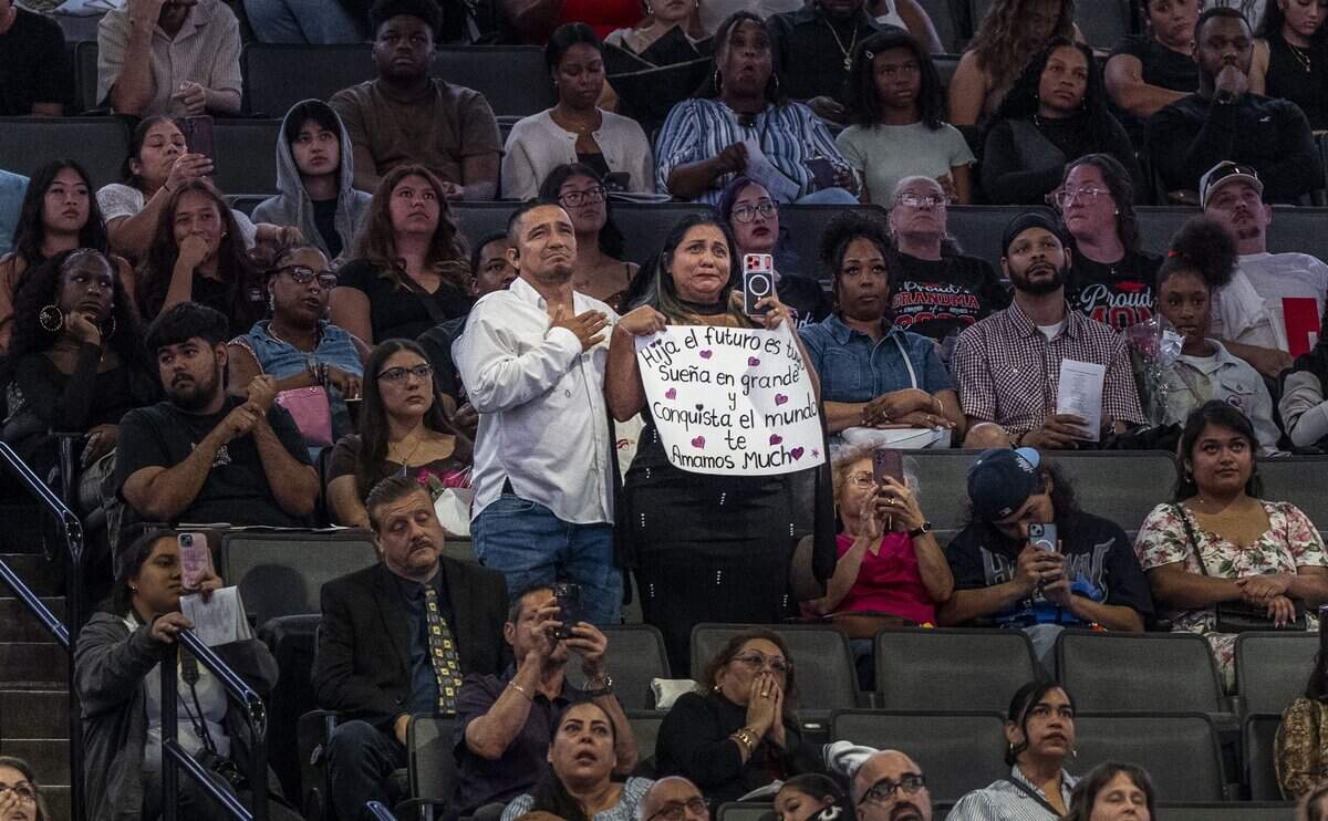Julio Lopez and Greybis Guandique stand for their daughter, Greybis, as she thanks them for their support on the journey from their native Honduras during the C.K. McClatchy High School graduation at Golden 1 Center on Monday, June 8, 2026.