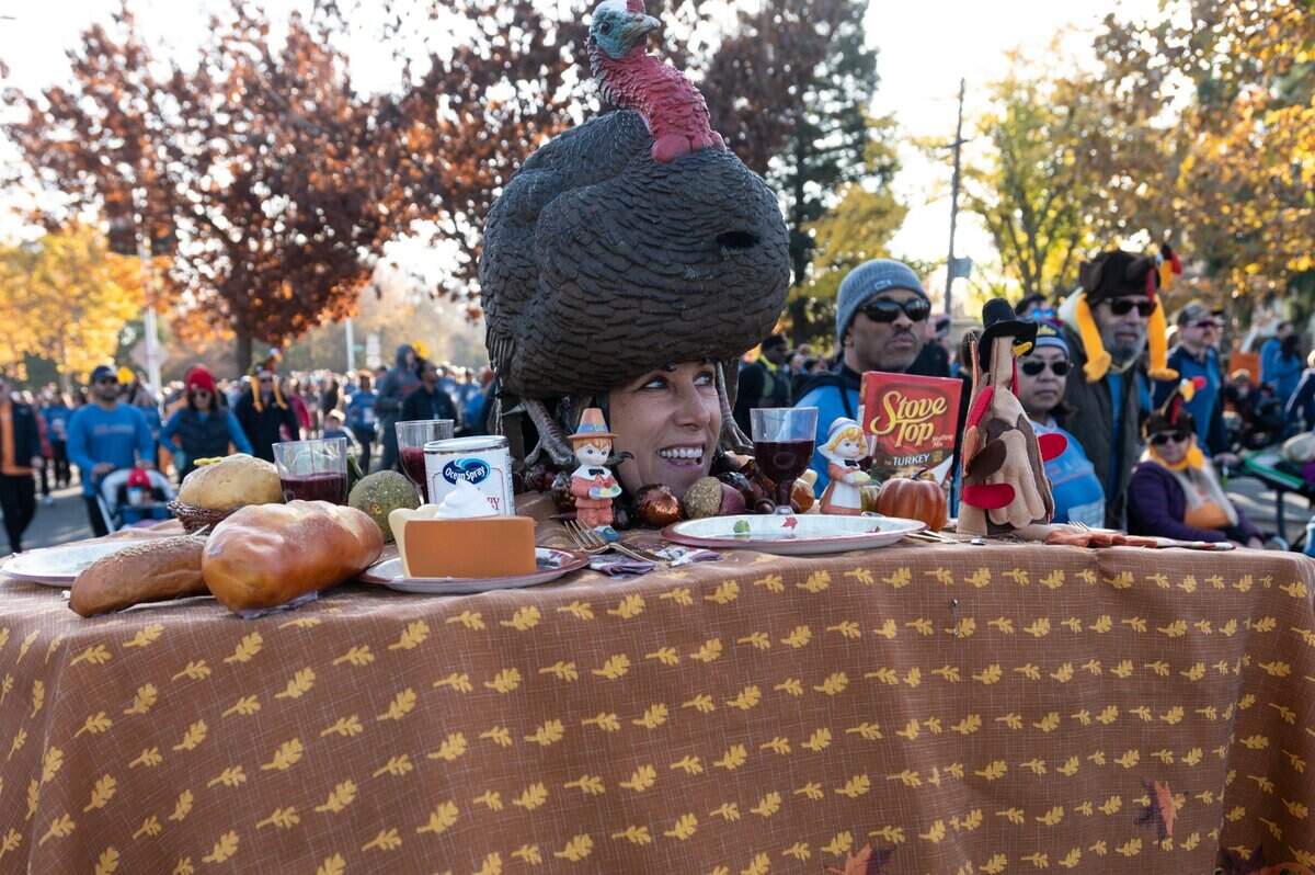Heather Oakes of Sacramento wears a thanksgiving table setting during the Run to Feed the Hungry in Sacramento on Thursday.