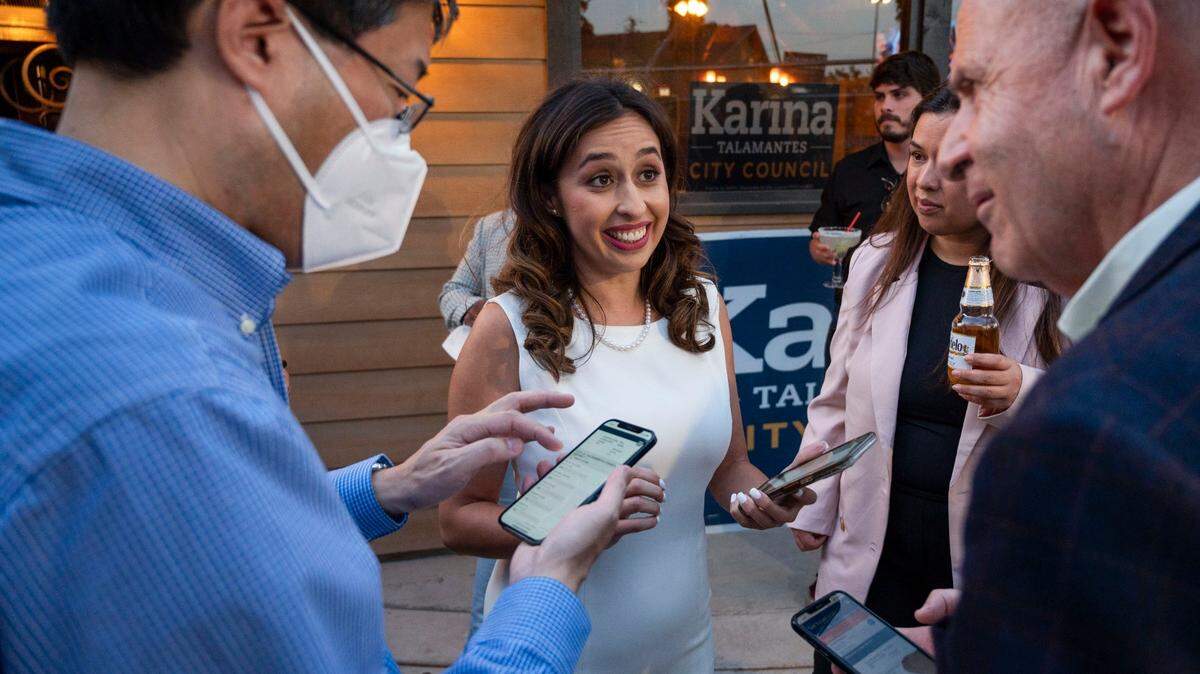 Sacramento City Council candidate Karina Talamantes, center, stands with state Sen. Richard Pan, left, and Mayor Darrell Steinberg as they celebrate her lead in early results during her election night party El Bramido Restaurant in North Natomas on Tuesday, June 7, 2022.