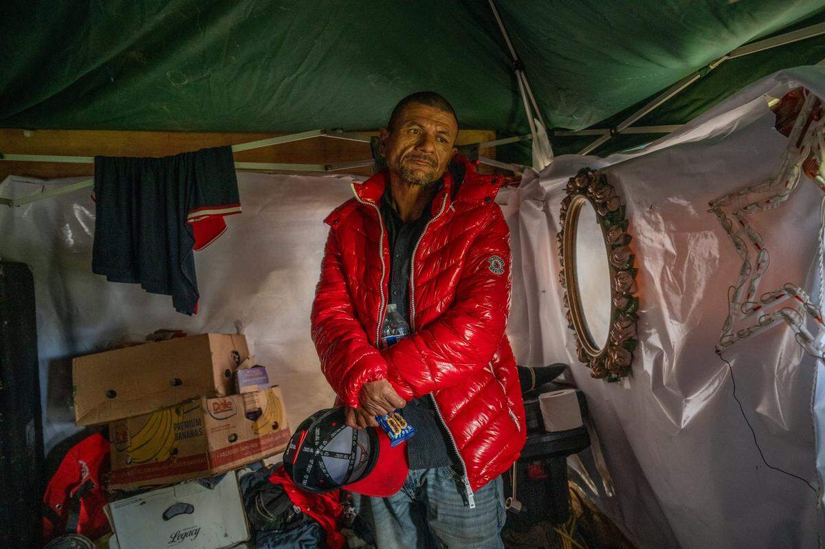 Alfredo Sanchez, who could only speak in Spanish, waits Wednesday in a friend’s tent that he was trying to save from being demolished during a homeless encampment sweep near the Sacramento Northern Bike Trail in North Sacramento. The home was demolished the next day, and everything was trashed by city workers. Homeless advocates said there were no city workers who could speak Spanish, and several people lost their belongings because of the lack of a translator.
