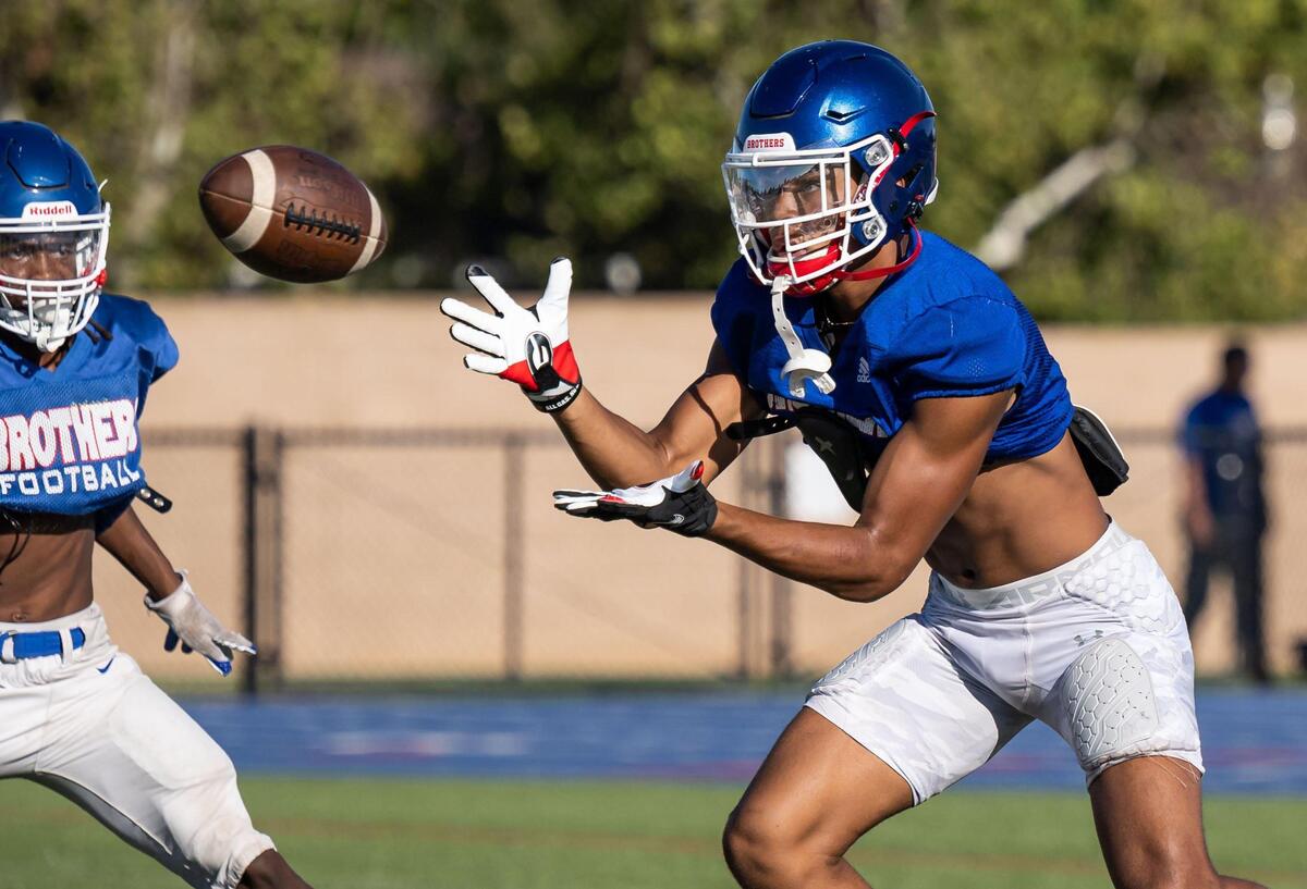 Phillip Bell, only a sophomore and already a varsity football standout wide receiver, practices with Christian Brothers High School teammates in August.
