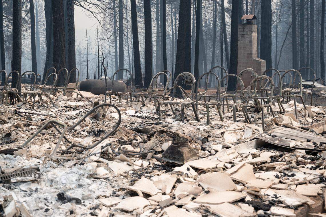 The frames of the chairs and the chimney are the only things that remain at the Grizzly Flats Community Church on Tuesday after the Caldor Fire raged through Grizzly Flats.